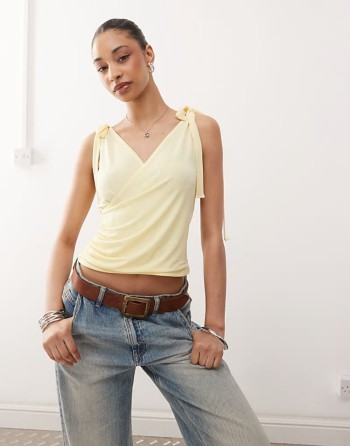 wrap front tank top with bow shoulder in buttermilk yellow wrap front tank top with bow shoulder in buttermilk yellow