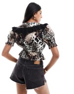 collared tie front blouse in animal print